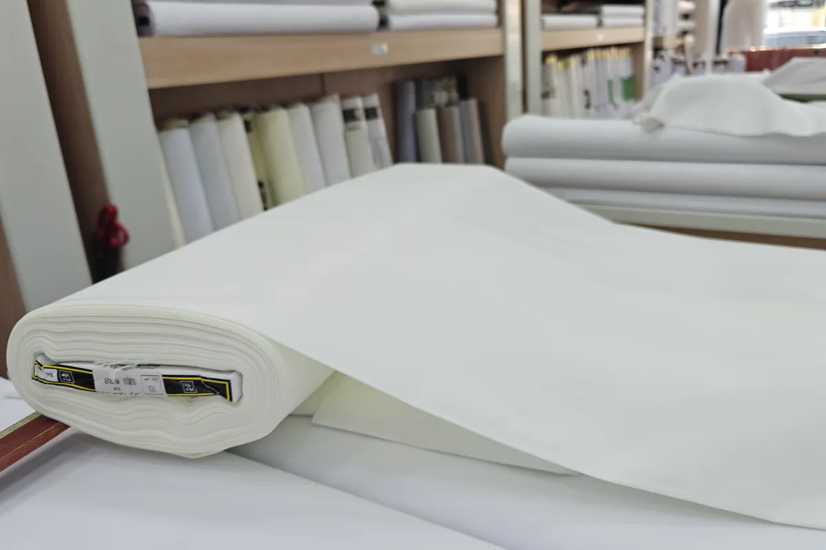 A roll of cream thobe fabric at the Medina Road branch