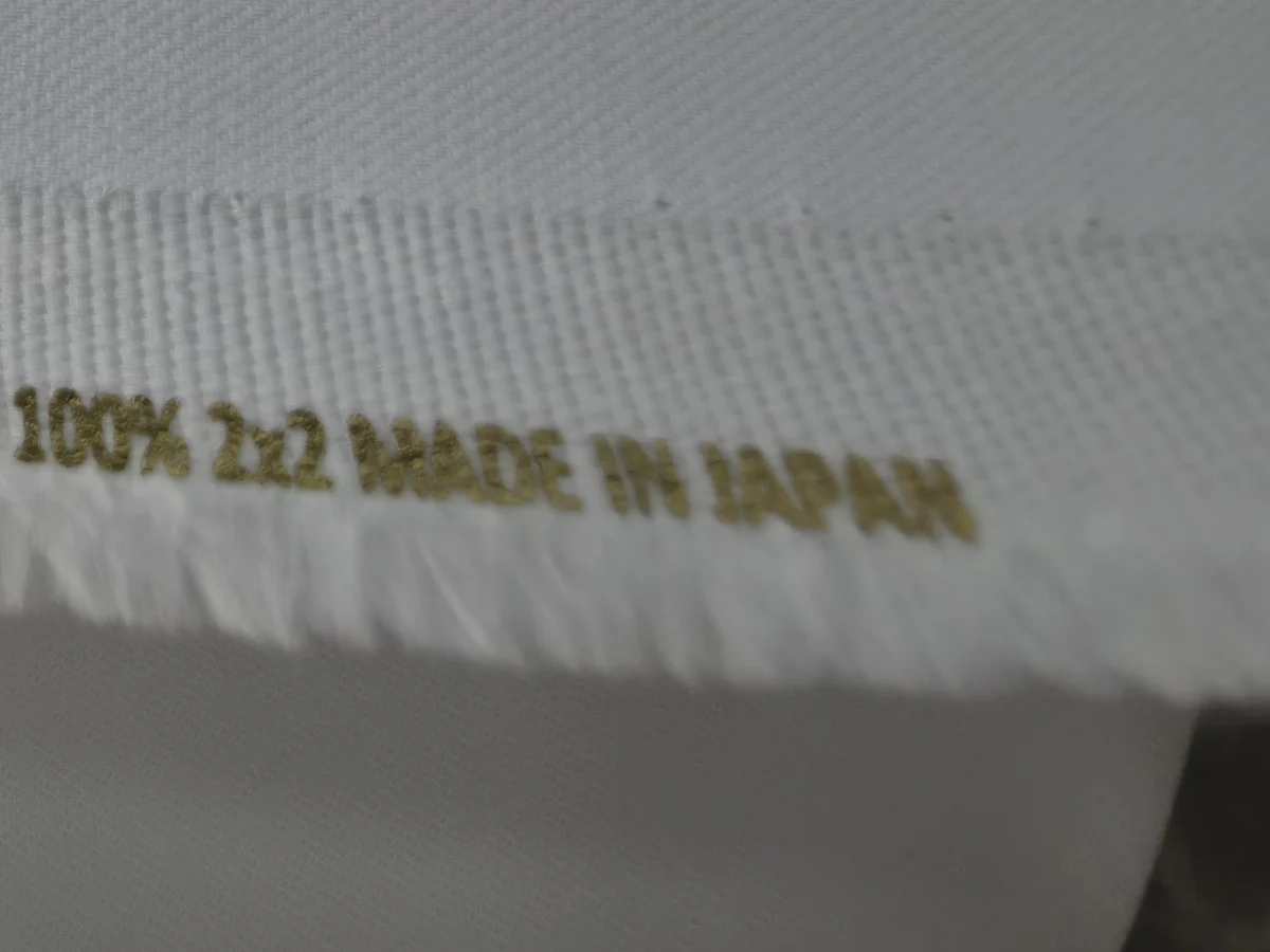 The gold “100% — Made in Japan” print on the cotton selvedge