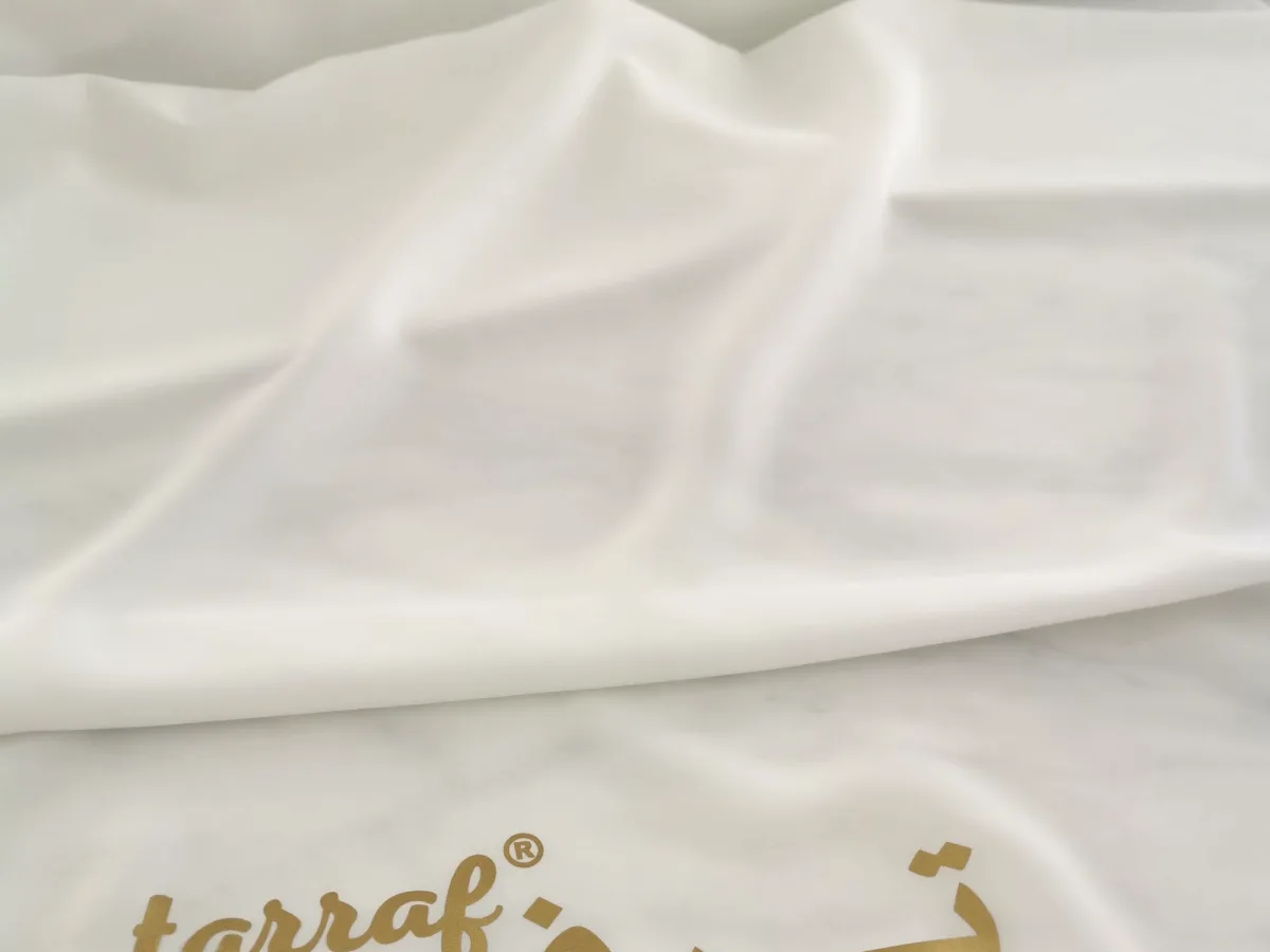 The name “Tarraf” and country of origin printed on the filament fabric