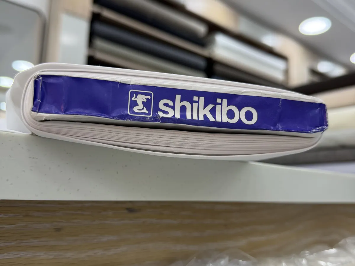 A roll of Shikibo Japanese fabric in the Ramada showroom