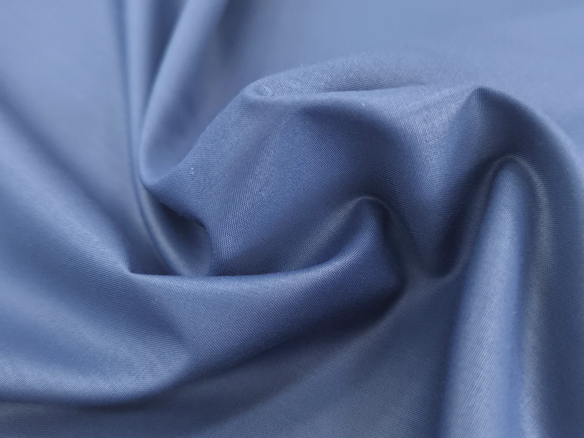 Blue polyester fabric in soft folds