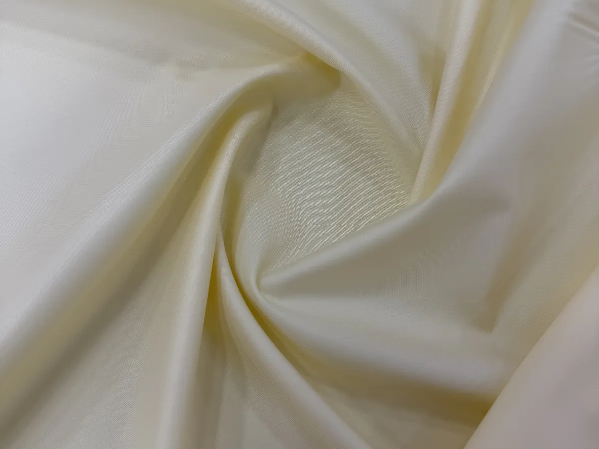 Cream Sukruta fabric in soft folds