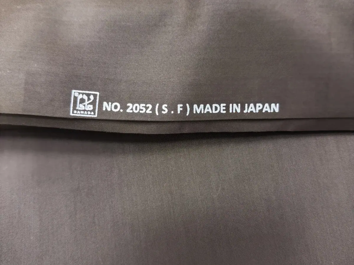 Selvedge of summer fabric No. 2052 with the Ramada logo and “Made in Japan”