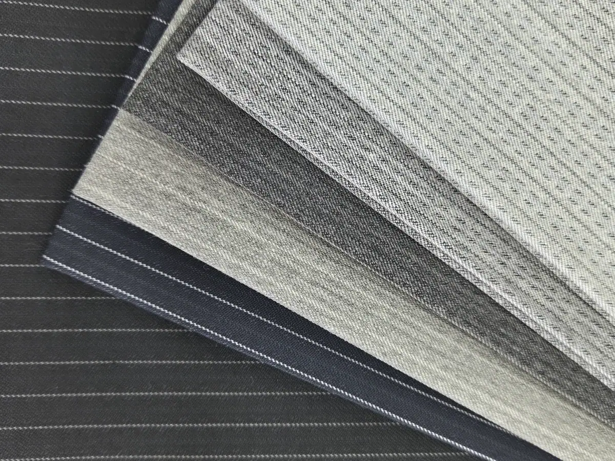 Striped winter fabric samples in shades of grey and blue