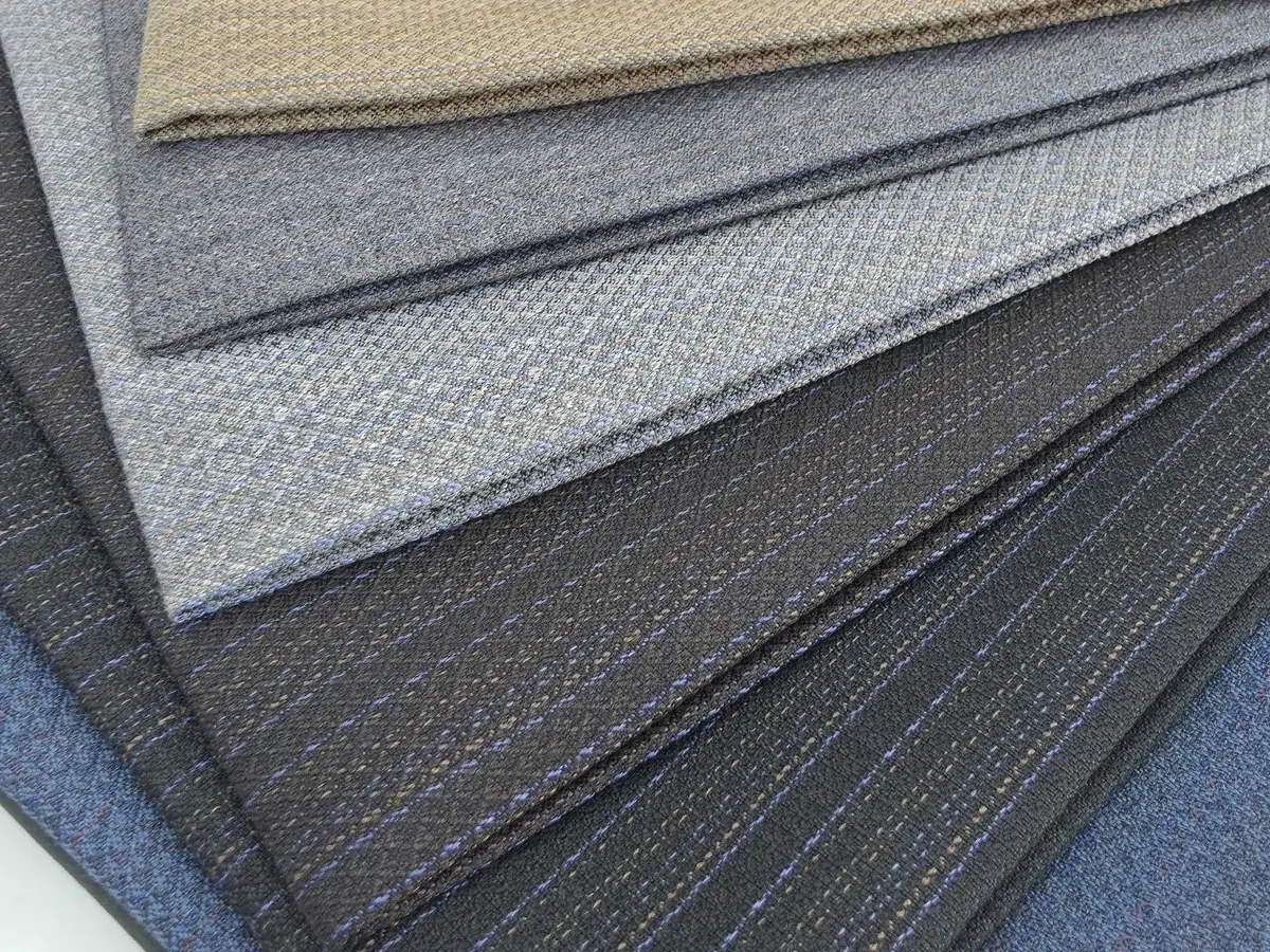 Patterned winter fabric samples in beige, grey and blue