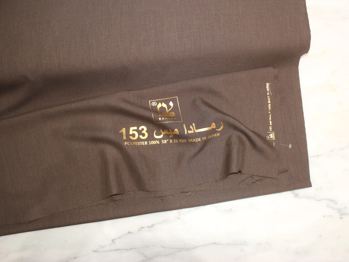 The gold “Ramada Miss” print on the twill selvedge