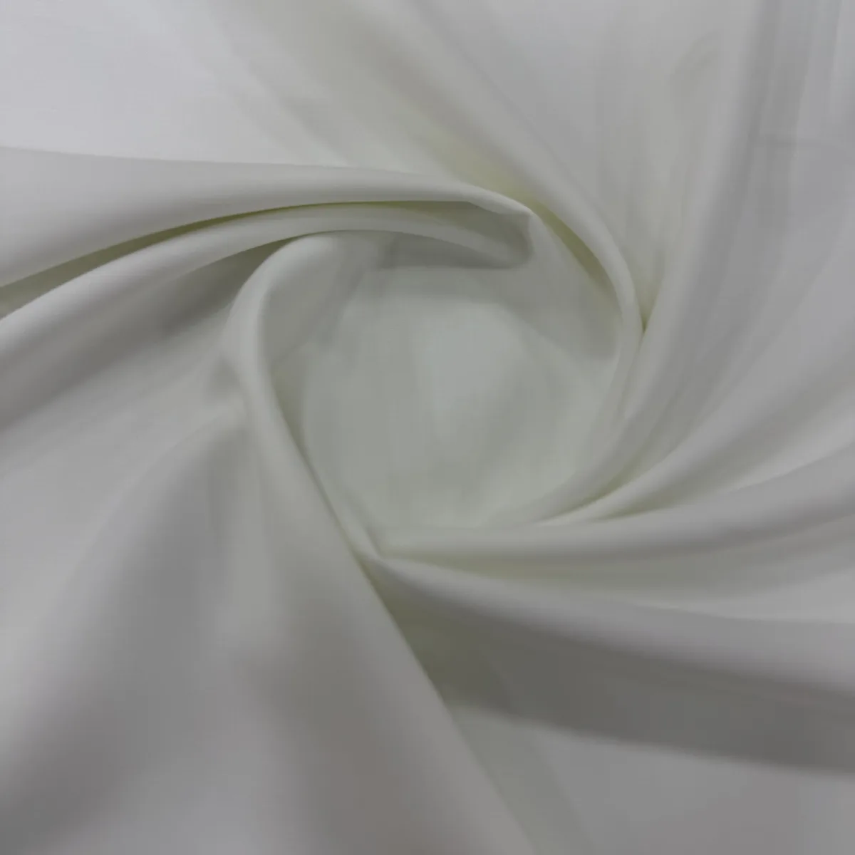Light white summer fabric in soft folds