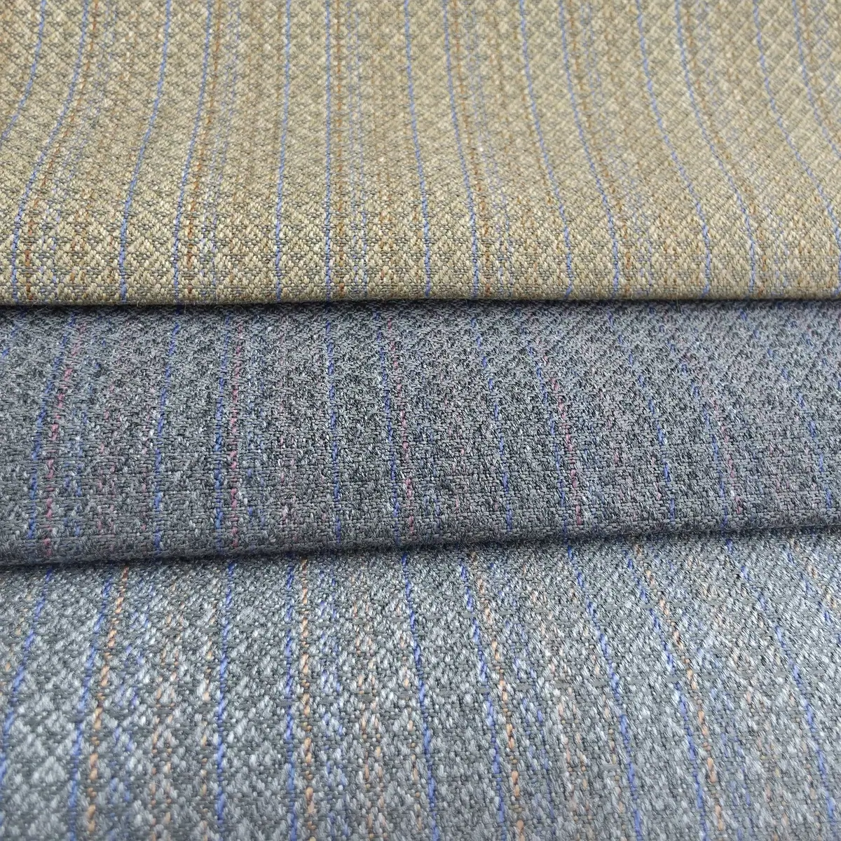 A set of winter fabrics with striped patterns in grey, brown and blue