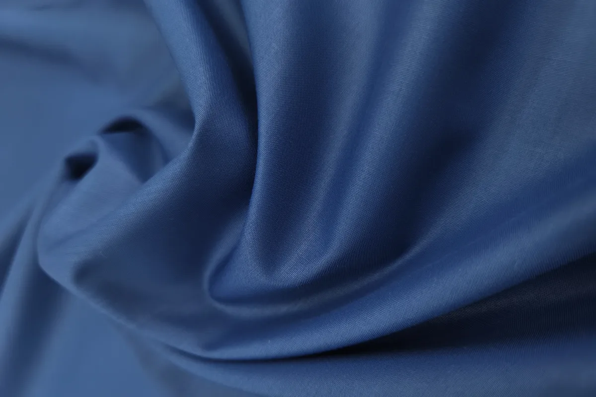 Close-up of blue fabric in soft folds