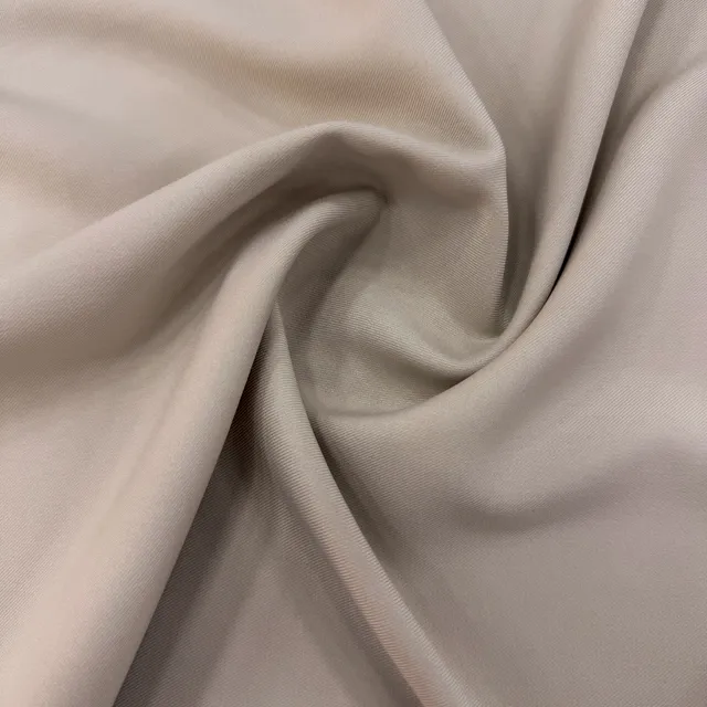 Beige Yamori fabric in soft folds