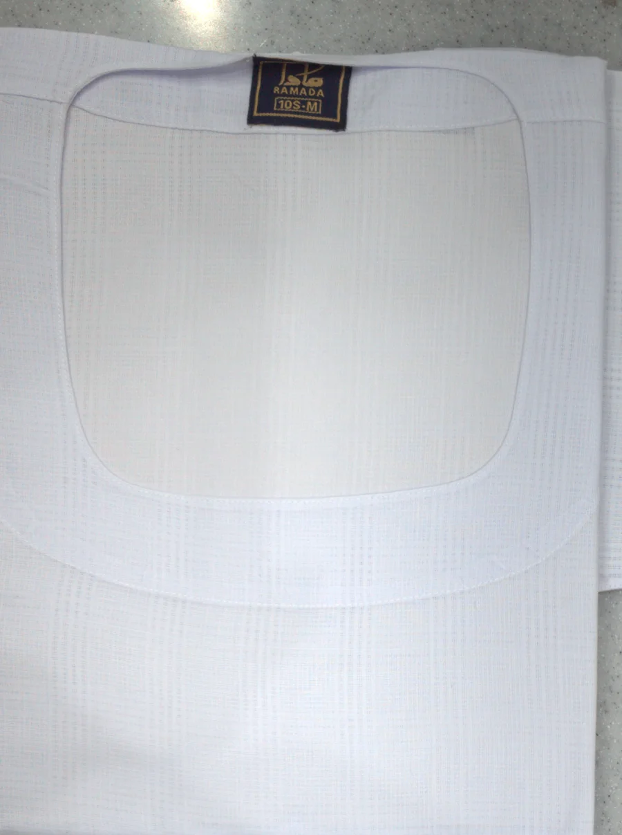 Folded white Maslub Sudanese ararig with a round collar and a Ramada tag
