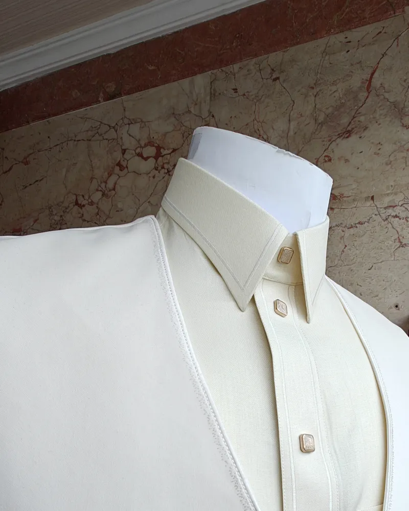 A cream-coloured sidiri over a thobe on a mannequin