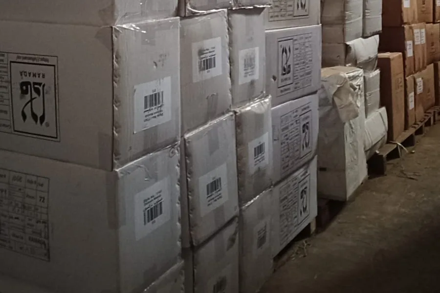 Cartons of goods bearing the Ramada logo stacked in one of the company’s warehouses in Jeddah